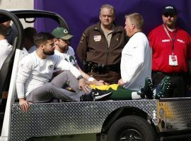 Green Bay quarterback Aaron Rodgers is seen on a cart being driven off the field after breaking his collarbone against Minnesota October 15. (Image: Associated Press)