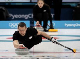 OAR mixed doubles curler Alexander Krushelnitsky is suspected of doping, which could cause his team to forfeit their bronze medals. (Image: AP/Aaron Favila)