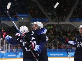 The United States kept their medal hopes alive in men’s Olympic hockey by defeating Slovakia 5-1 to reach the tournament quarterfinals. (Image: SI.com)