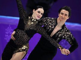 Tessa Virtue and Scott Moir of Canada set a new world record in the short dance portion of the Olympic ice dancing competition. (Image: Reuters/Phil Noble)