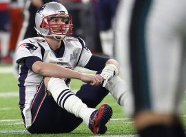 New England quarterback Tom Brady sits dejected after losing Sunday’s Super Bowl but his performance made gamblers a lot of money in proposition bets. (Image: Getty)