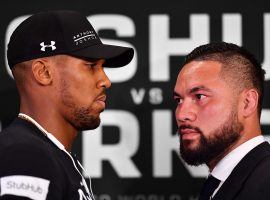 Anthony Joshua (left) is set to face off against Joseph Parker (right) on Saturday, with the winner emerging as the unified heavyweight champion of the world. (Image: Justin Setterfield/Getty)