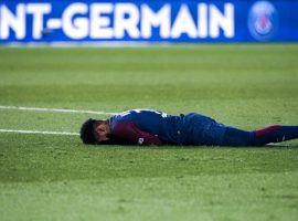 Soccer star Neymar lies on the field in pain after breaking a bone in his foot in a match with his regular team, Paris Saint-Germain. (Image: AFP)