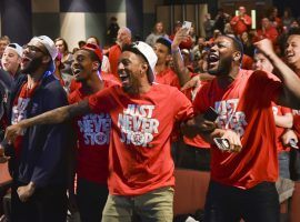 Members of the Radford men’s basketball team react when they found out they were going to the NCAA Tournament. (Image: Michael Shroyer/Special to the Roanoke Times)