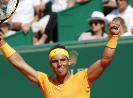 Rafael Nadal celebrates his 11th career Monte Carlo Masters title after defeating Ken Nishikori 6-3, 6-2 on Sunday. (Image: Chistope Ena/AP)