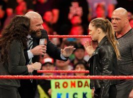 The most anticipated match of WrestleMania 34 is a tag team clash that pits Ronda Rousey and Kurt Angle against Triple H and Stephanie McMahon. (Image: WWE)