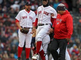 Xander Bogaerts exits Sunday’s game against the Tampa Bay Rays with an injured ankle that will keep him out for about two weeks. (Image: Nancy Lane/Boston Herald)