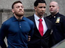 Conor McGregor is led out of jail in handcuffs after his arrest last week in New York City. (Image: Reuters)