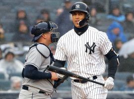 Giancarlo Stanton walks back to the dugout after one of his five strikeouts on Tuesday. (Image: Charles Wenzelberg/New York Post)