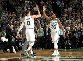 Boston Celtics players Jayson Tatum and Marcus Smart celebrate during Boston’s Game 5 victory over the Philadelphia 76ers. (Image: Brian Babineau/Getty Images)