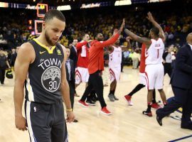 Steph Curry looks on in disappointment as the Houston Rockets celebrate winning Game 4 of the 2018 Western Conference finals. (Image: Ezra Shaw/Getty)