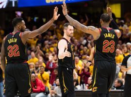 LeBron James celebrates with teammates Kevin Love and Jeff Green during Game 4 of the Cavaliers’ sweep over the Toronto Raptors. (Image: Jason Miller/Getty)