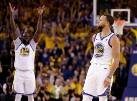 Draymond Green (left) celebrates a 3-pointer made by Stephen Curry (right) during Golden State’s Game 5 victory over New Orleans on Tuesday. The Warriors will face the Rockets in the Western Conference finals. (Image: AP/Marcio Jose Sanchez)