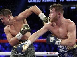 Canelo Alvarez (right) and Gennady Golovkin (left) exchange blows during their 2017 fight, which ended in a controversial draw. (Image: AP)