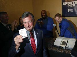 Delaware Governor John Carney shows off his ticket after placing the first single-game sports bet in the state at Dover Downs Hotel and Casino. (Image: Patrick Semansky/AP)