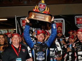 Clint Bowyer holds his trophy after winning the FireKeepers Casino 400 at Michigan International Speedway on Sunday. (Image: Getty)