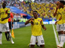 Yerry Mina (#13) celebrates with teammates after scoring the winning goal for Colombia in their 1-0 victory over Senegal. (Image: Manan Vatsyayana/AFP)