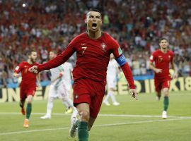 Cristiano Ronaldo celebrates after scoring on a penalty kick vs. Spain at the 2018 World Cup, his first of three goals in the match. (Image: PA)