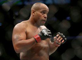 Daniel Cormier stands during a light heavyweight championship fight against Volkan Oezdemir at UFC 220. (Image: Gregory Payan/AP)