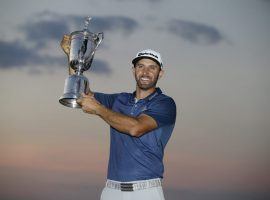 Dustin Johnson lifts his trophy after winning the 2016 US Open at Oakmont Country Club. (Image: AP/John Minchillo)