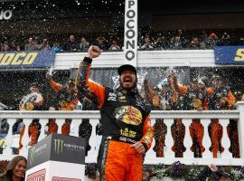 Martin Truex Jr. celebrates after winning the Pocono 400 at Pocono Raceway on Sunday, his second victory of the 2018 NASCAR Cup Series season. (Image: Getty)