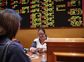 A gambler collects a winning bet from the sportsbook at the South Point Hotel Casino in Las Vegas. (Image: AP/John Locher)
