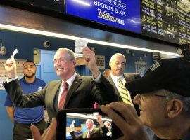 New Jersey Governor Phil Murphy holds his slips after placing the first legal sports bets in the state at Monmouth Park on Thursday morning. (Image: Evan Grossman/NY Daily News)