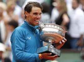 Rafael Nadal poses with the trophy after beating Dominic Thiem in straight sets to win his 11th career French Open title. (Image: Thibault Camus/AP)