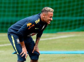 Neymar left Brazil’s World Cup training session on Tuesday with pain in his right ankle, an injury the team doctor says he suffered in the team’s match against Switzerland. (Image: EPA)
