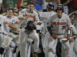 Oregon State players celebrate after Trevor Larnach’s ninth inning home run gave the Beavers a 5-3 lead in Game 2 of the 2018 College World Series. (Image: Nati Harnik/AP)