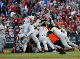Oregon State players celebrate following their 5-0 win over Arkansas in Game 3 of the College World Series final, which earned them the school’s third national championship. (Image: Nati Harnik/AP)