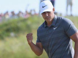Brooks Koepka reacts to a par-saving putt that helped him win his second consecutive US Open. (Image: Getty)