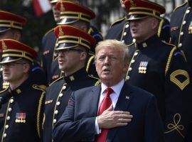 President Donald Trump sings the National Anthem during a "Celebration of America" event at the White House on Tuesday after cancelling an appearance by the Super Bowl Champion Philadelphia Eagles. (Image: Susan Walsh/AP)