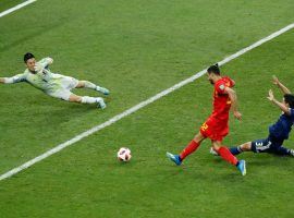 Belgium’s Nacer Chadli puts the winning goal past Japanese goalkeeper Eiji Kawashima in stoppage time to clinch a 3-2 win for Belgium at the 2018 World Cup. (Image: Hassan Ammar/AP)