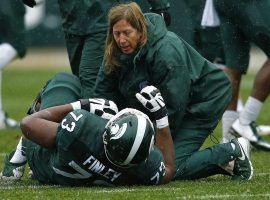 Michigan State tackle Dennis Finley (#73) is treated by trainers after being injured in a game against Purdue on October 3, 2015. (Image: Mike Mulholland/MLive.com)