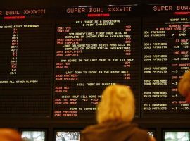 Gamblers prepare to place bets at a sportsbook ahead of the 2004 Super Bowl between the Carolina Panthers and the New England Patriots. (Image: Joe Cavareta/AP)