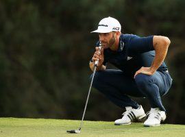 Dustin Johnson lines up a put on the 18th green during the Sentry Tournament of Champions in January 2018. (Image: Gregory Shamus/Getty)