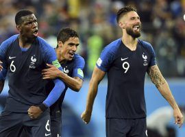 Paul Pogba (6), Olivier Giroud (9), and Raphael Varane (4) celebrate following France’s 1-0 win over Belgium in the semifinals of the 2018 FIFA World Cup. (Image: Tim Groothuis/USA Today Sports)