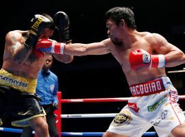 Manny Pacquiao throws a punch at Lucas Matthysse during their WBA welterweight title fight on July 15, 2018. (Image: Reuters/Lai Seng Sin)