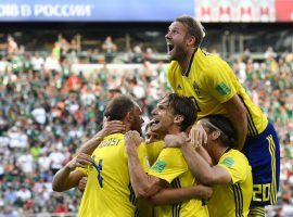Swedish players celebrate after Andreas Granqvist (left) scores the second goal in the team’s 3-0 win over Mexico at the 2018 World Cup. (Image: Martin Meissner/AP)