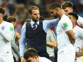 England Manager, Gareth Southgate, consoles his team after their bitter loss to Croatia. (Image: AFP)