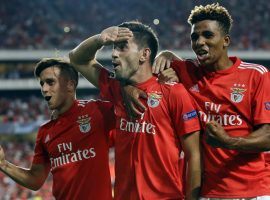 Benfica’s Pizzi (center) celebrates with teammates after scoring on a penalty kick in his team’s 1-1 draw against PAOK during the first leg of the Champions League playoffs. (Image: AP/Armando Franca)