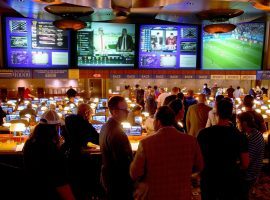 Bettors line up at the Borgata Race and Sports Book in Atlantic City, which began taking sports bets in June. (Image: Tom Gralish/Philadelphia Inquirer)