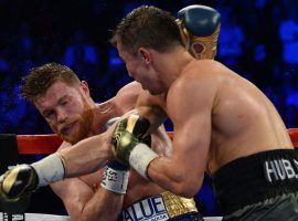Saul “Canelo” Alvarez (left) and Gennady “GGG” Golovkin (right) trade blows during their first meeting in September 2017. (Image: Joe Camporeale/USA Today Sports)