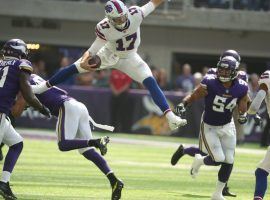 Buffalo Bills quarterback Josh Allen (17) hurdles a Minnesota Vikings defender during Buffalo’s 27-6 victory over Minnesota on Sunday, Sept. 23, 2018. (Image: James P. McCoy/Buffalo News)
