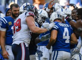 Adam Vinatieri's teammates and opponents congratulate the future Hall of Famer after making his record-setting kick against Houston on Sunday. (Image: Paul ellis/Getty)
