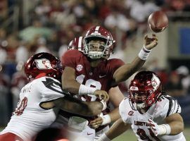 Alabama quarterback Tua Tagovailoa improved his Heisman odds with a strong performance against Louisville. (Image: AP)