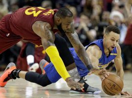 LeBron James and Stephen Curry battle it out in the 2017 NBA Finals (Image: Tony Dejak / AP)
