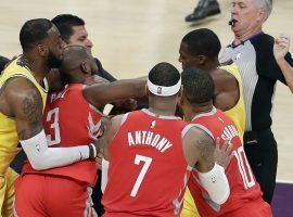 LeBron James attempts to separate Chris Paul from Rajon Rondo during a fight in the Lakers and Rockets game (Image: Marcio Jose Sanchez/AP)