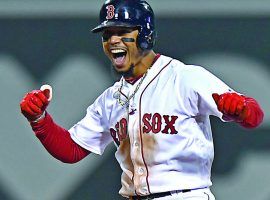 Boston Red Sox outfielder Mookie Betts celebrates after hitting an RBI double against the Houston Astros in Game 2 of the 2018 ALCS. (Image: Christopher Evans/Boston Herald)